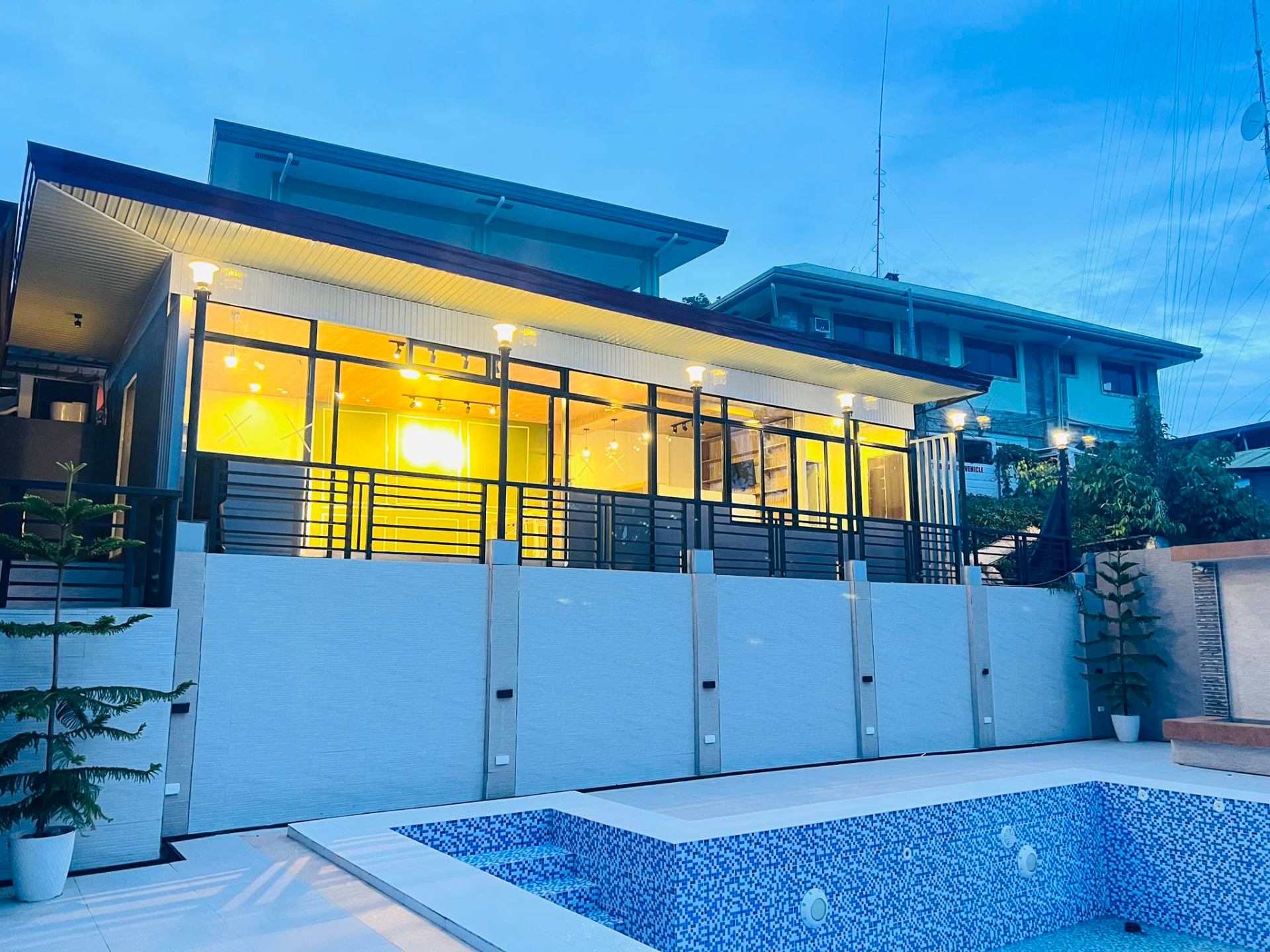 Villa exterior lit up in the evening